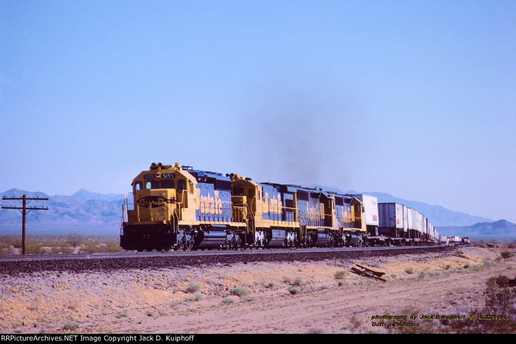 AT&SF, Santa Fe SD40-2 5155- U36C 8798- SD45-2 5663 & 5637, with a westbound trailer train at Goffs, California. June 22, 1984. 